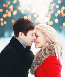 romantic couple, holiday lights, outdoor in winter