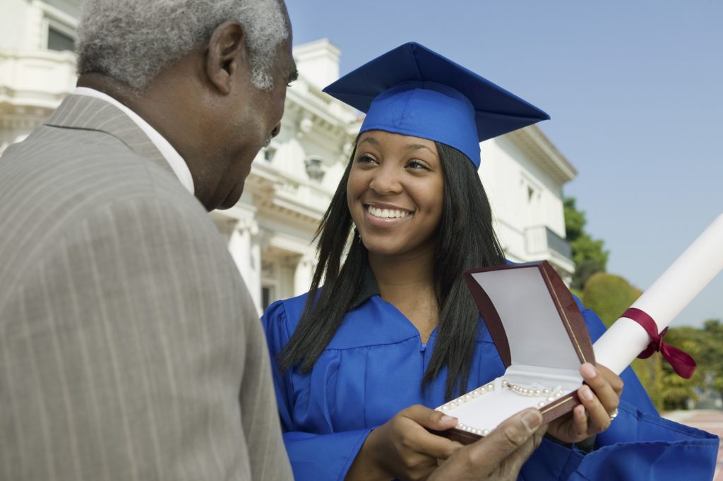 Father Giving Daughter Graduation Gift