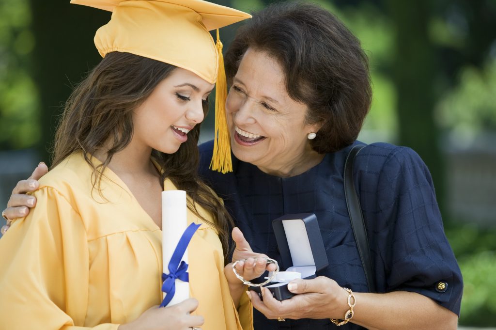 Graduate Receiving Gift from Grandmother